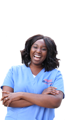 Michelle Bonsu stands in a nursing scrubs with arms crossed and laughs.