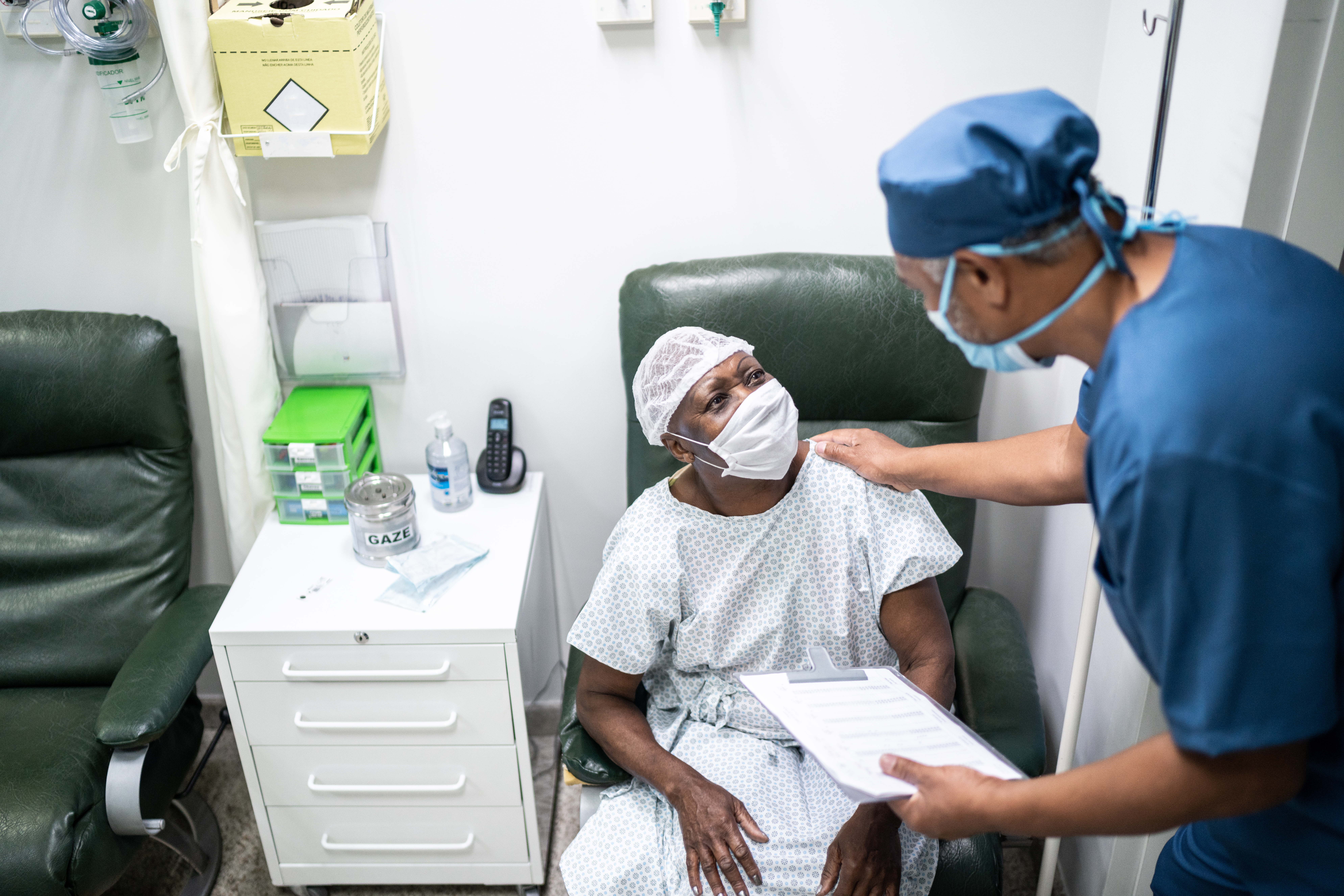 a doctor cares for a patient in a treatment room