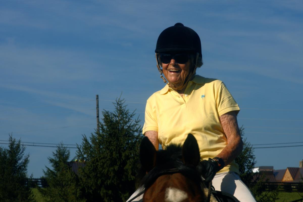 Carol Angle, age 90, a donor and grateful patient, rides her horse Tigger.