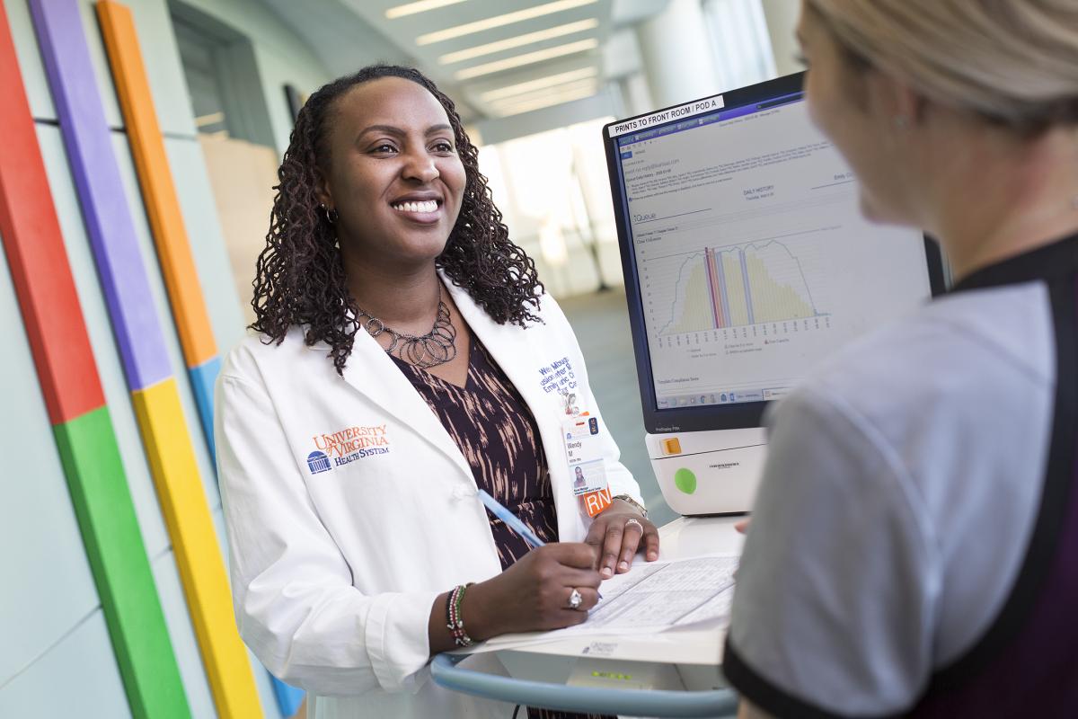 Wendy Mbugua, manager of UVA's Infusion Center, a cutting-edge technology, to improve patients' experiences.