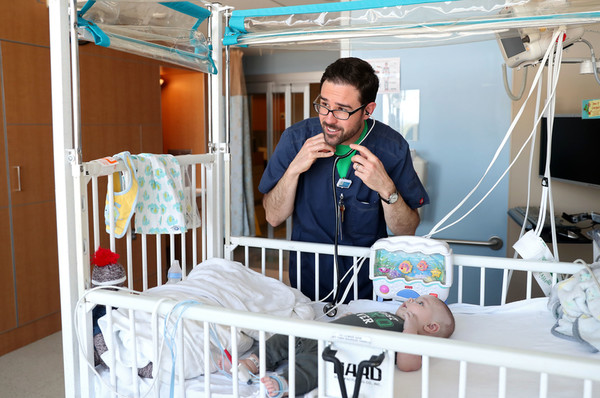 Ryan McFadden works with a young patient. 