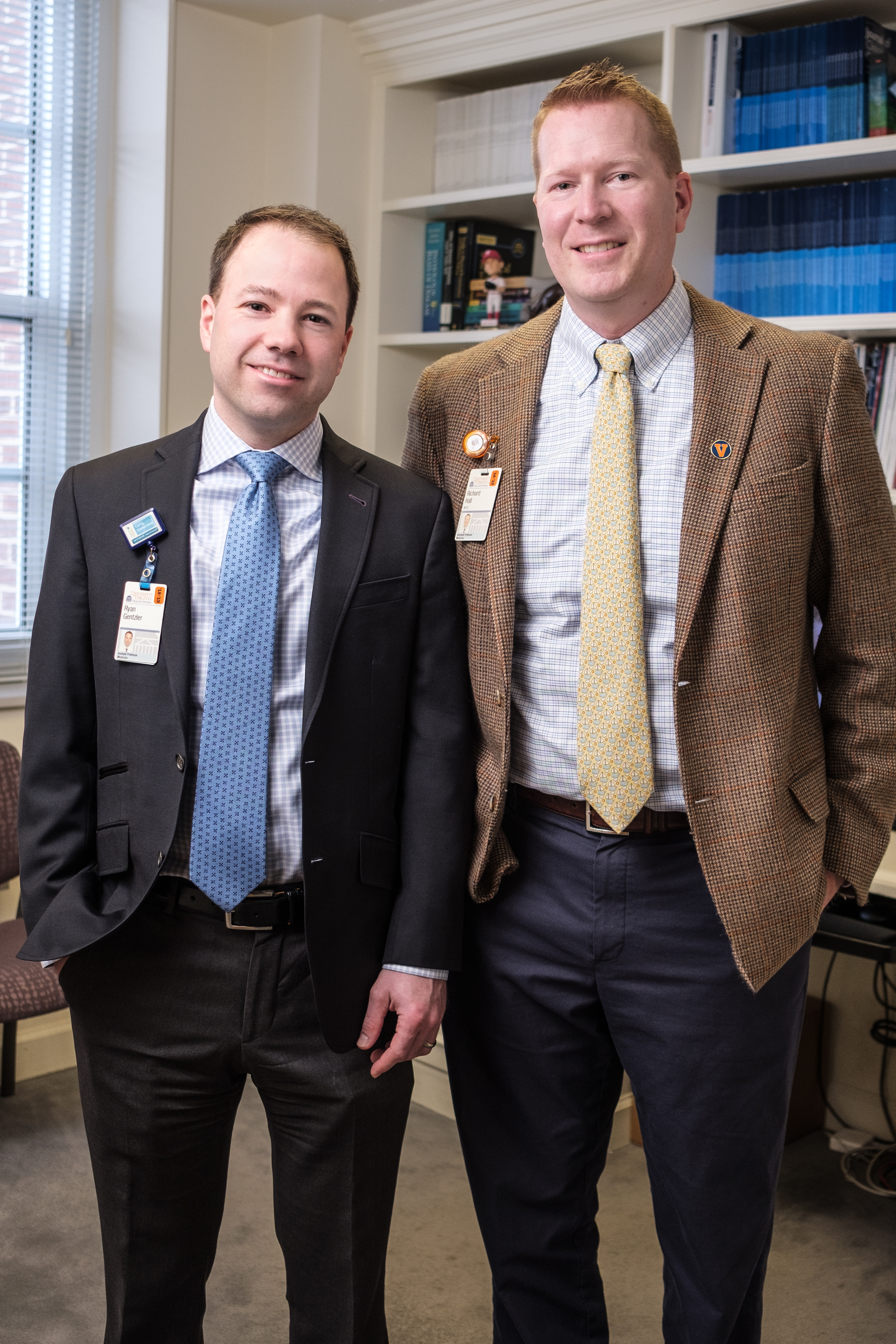 Dr. Ryan Gentzler (left) and Dr. Richard Hall stand next to each other and smile.