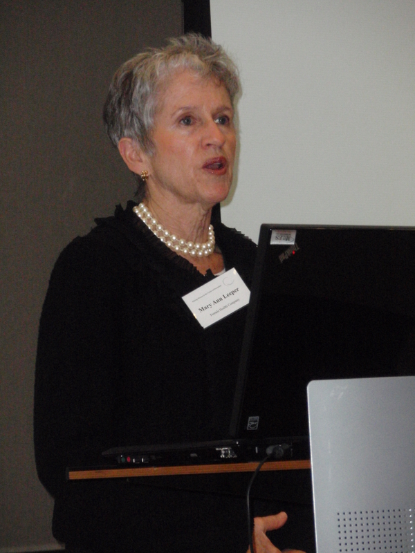 Mary Ann Leeper stands at a podium.