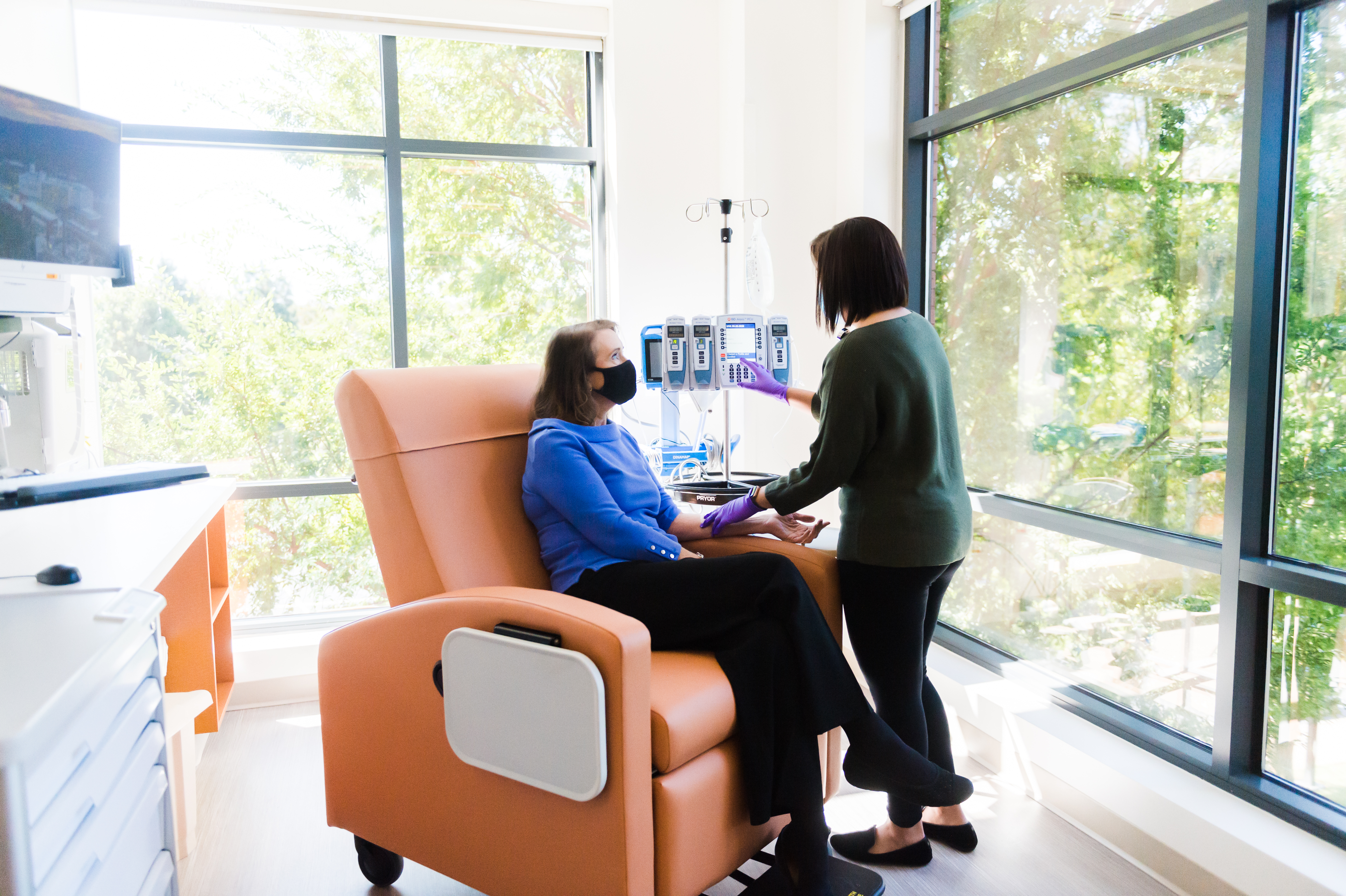 Nurse attends to patient in the new infusion center 