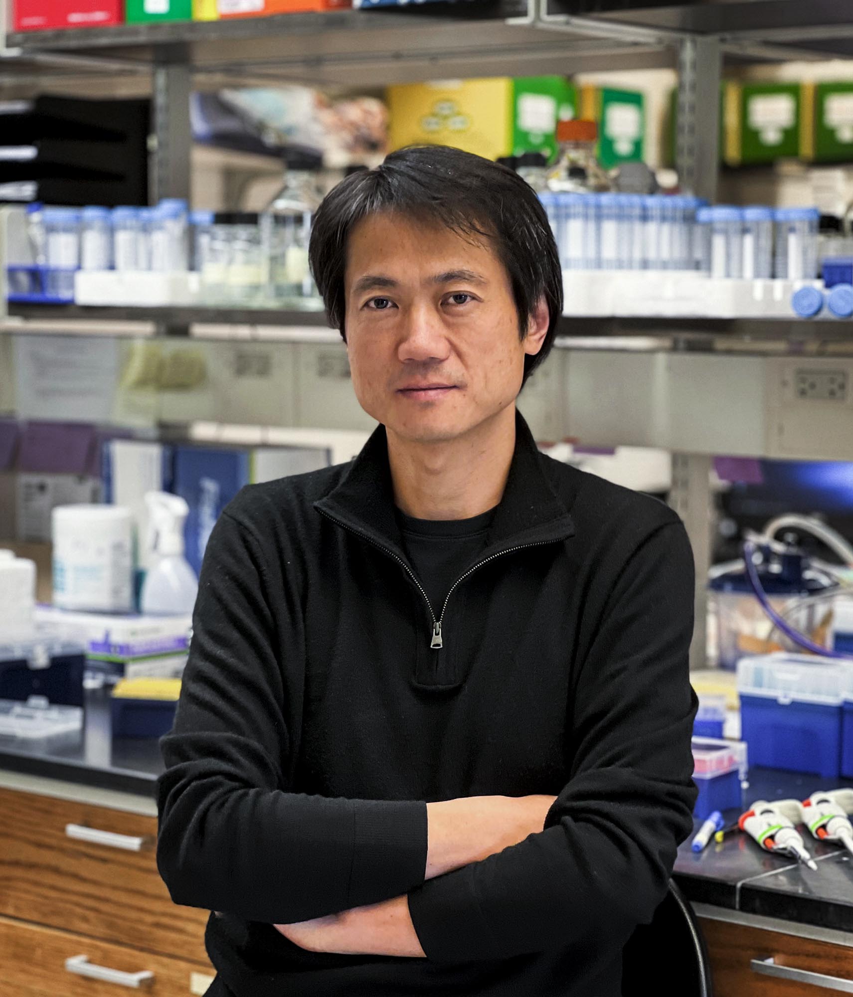 Hao Jiang stands in his lab