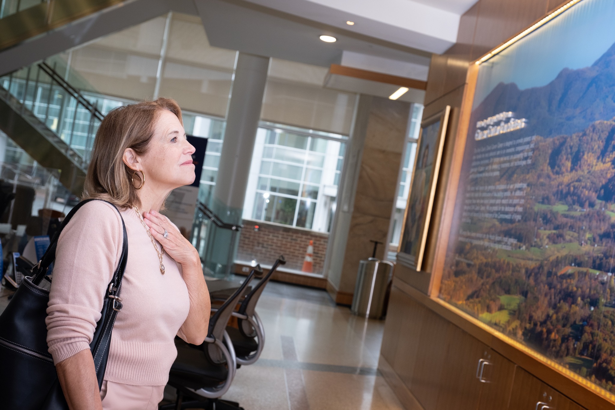 Couric viewing signage in the cancer center