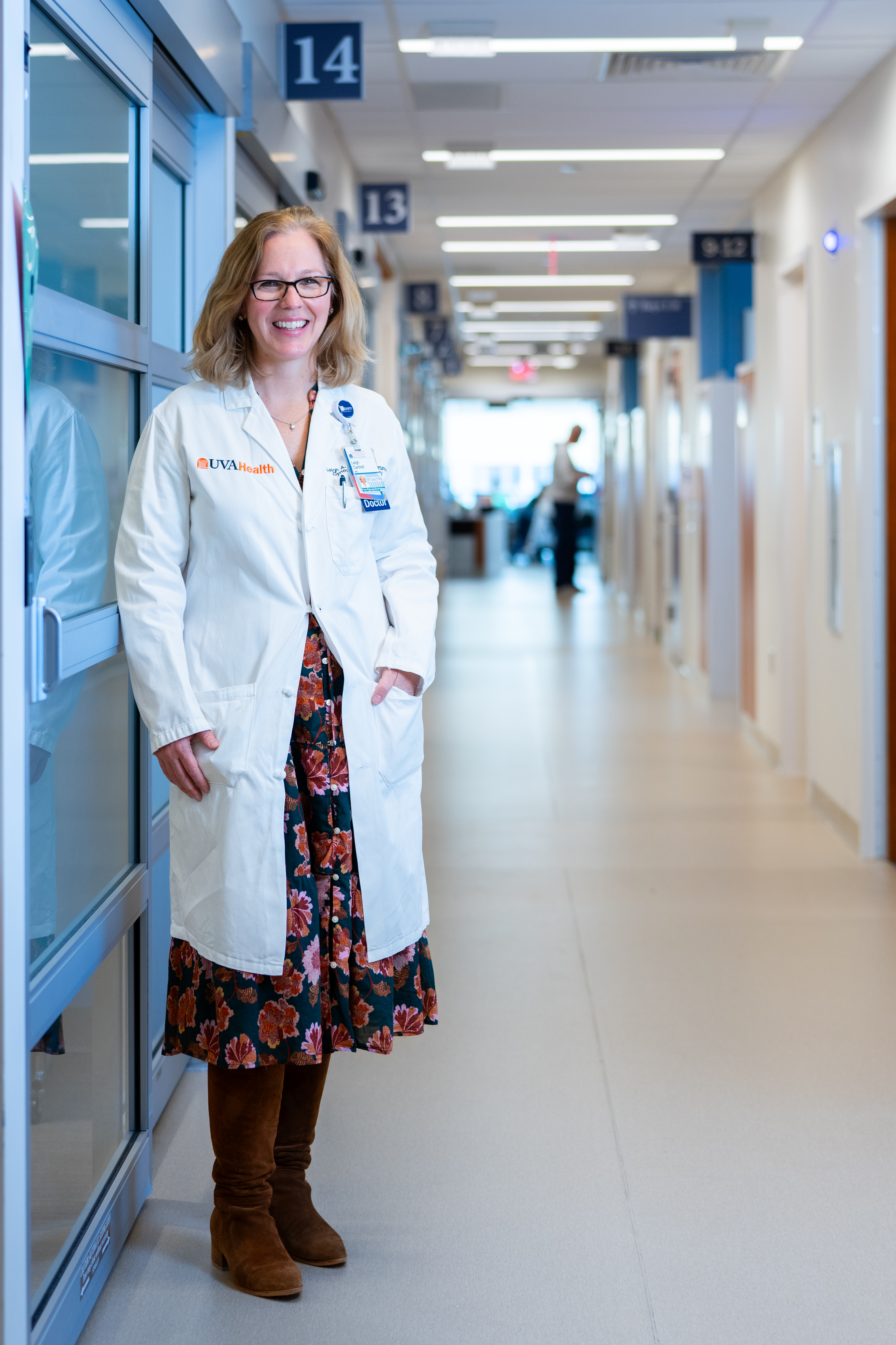 Dr. Cantrell standing in her white coat in the hallway