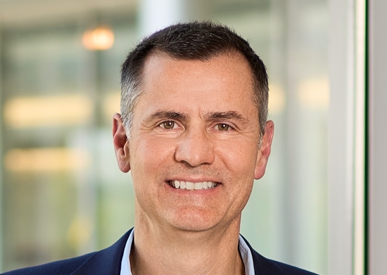 Mark Esser smiles in his headshot