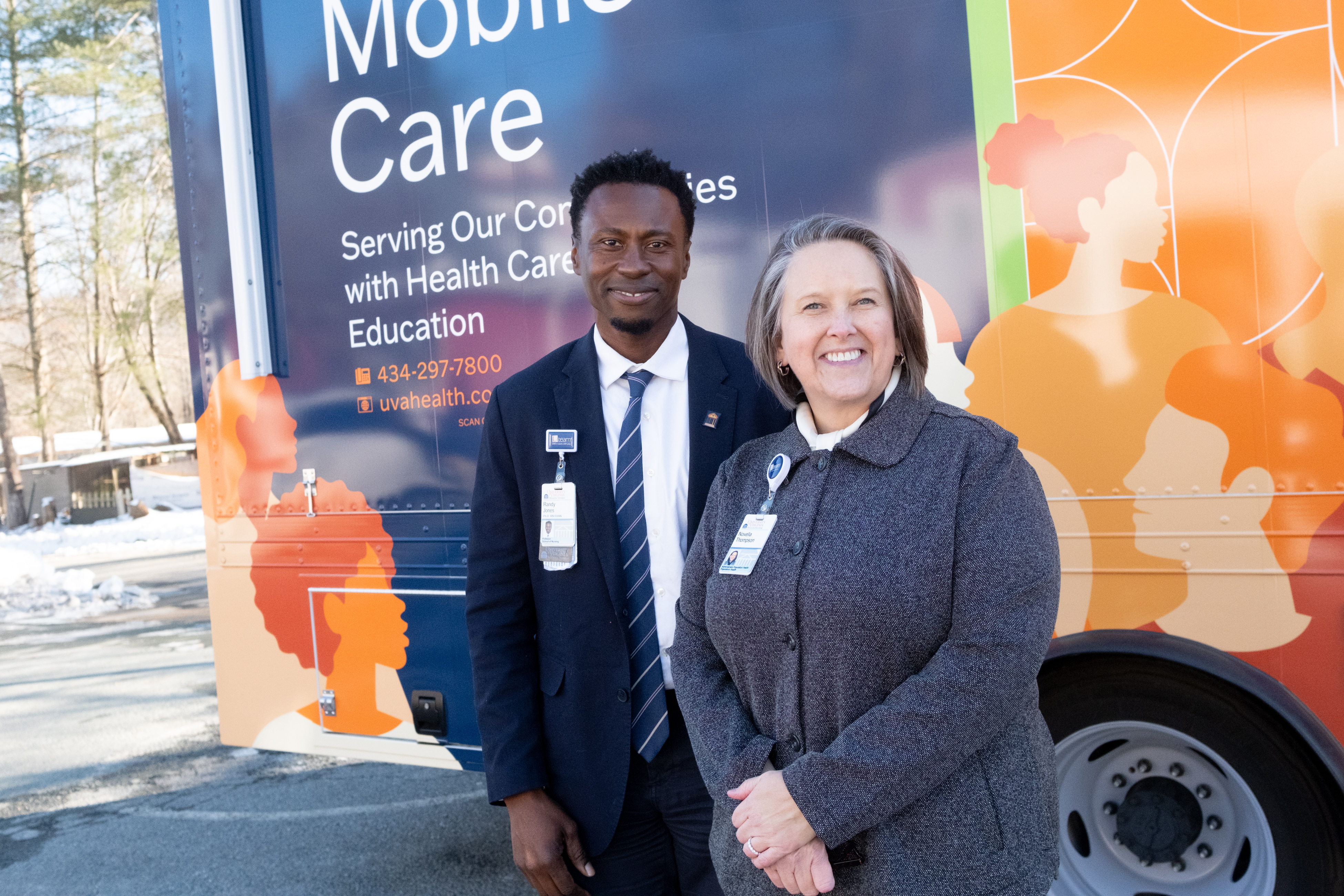 Randy Jones and Novella Thompson stand in front of mobile health unit