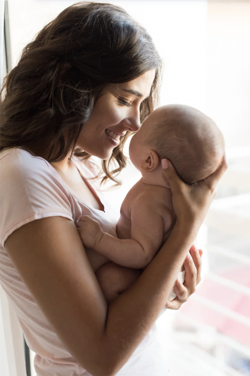 mother holding baby