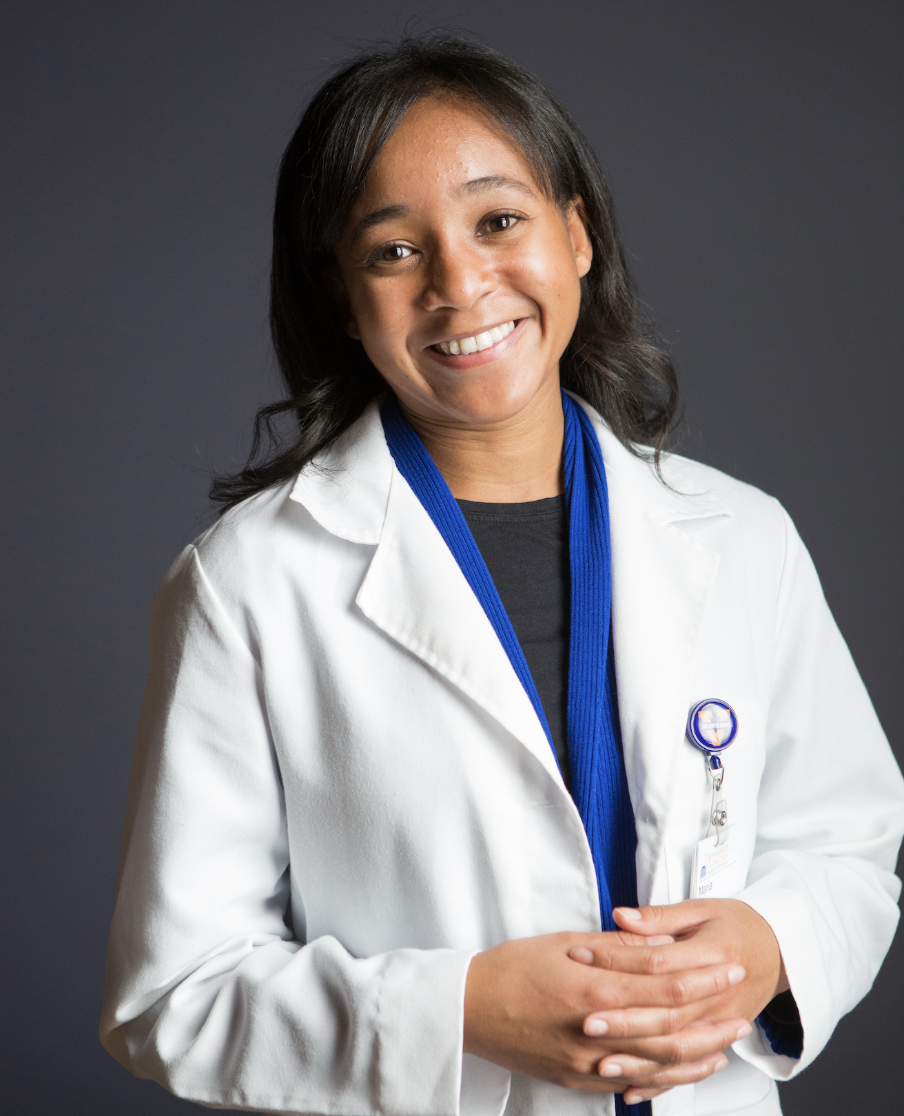 McDonald standing wearing a white coat