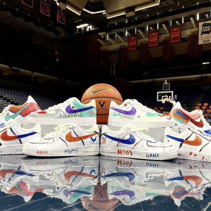 basketball shoes sit on the UVA court 