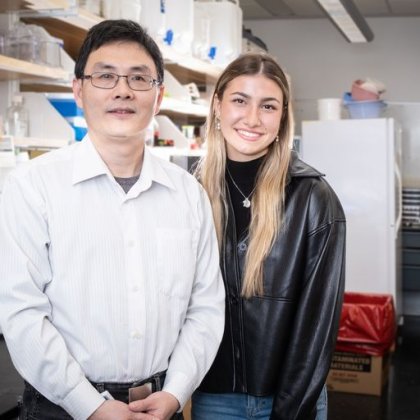 Sienna and Dr. Li stand in his lab