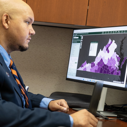 Keith Keene looks at a map on his computer