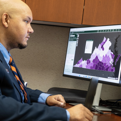 Keith Keene looks at a map on his computer 