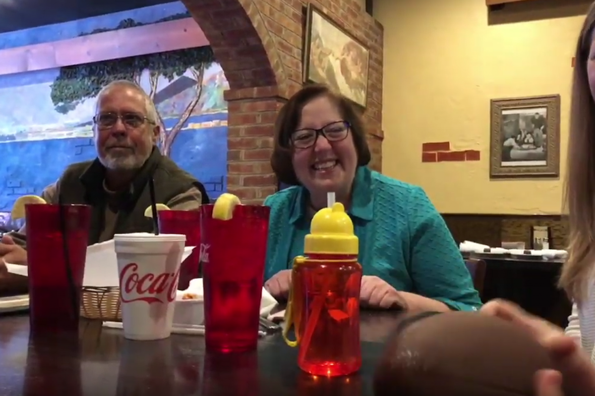Nancy Whitley and her husband laugh over dinner.