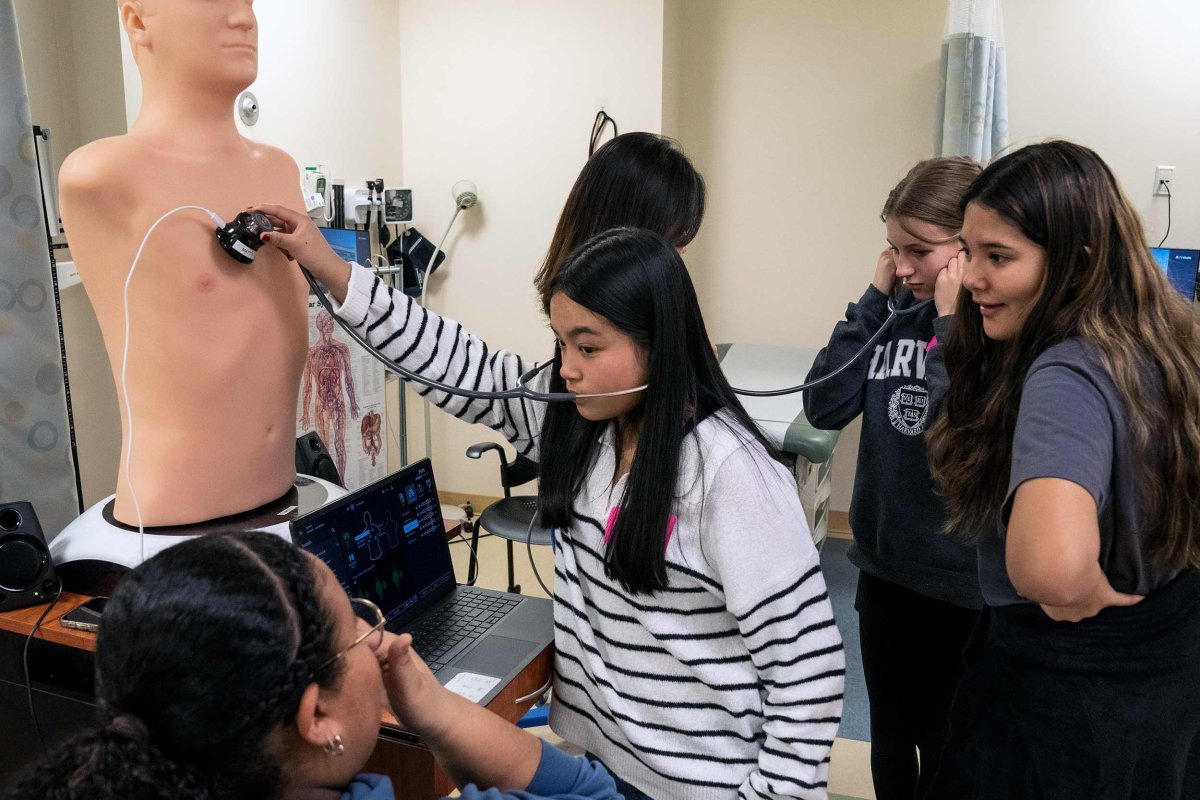 middle school students in the simulation lab