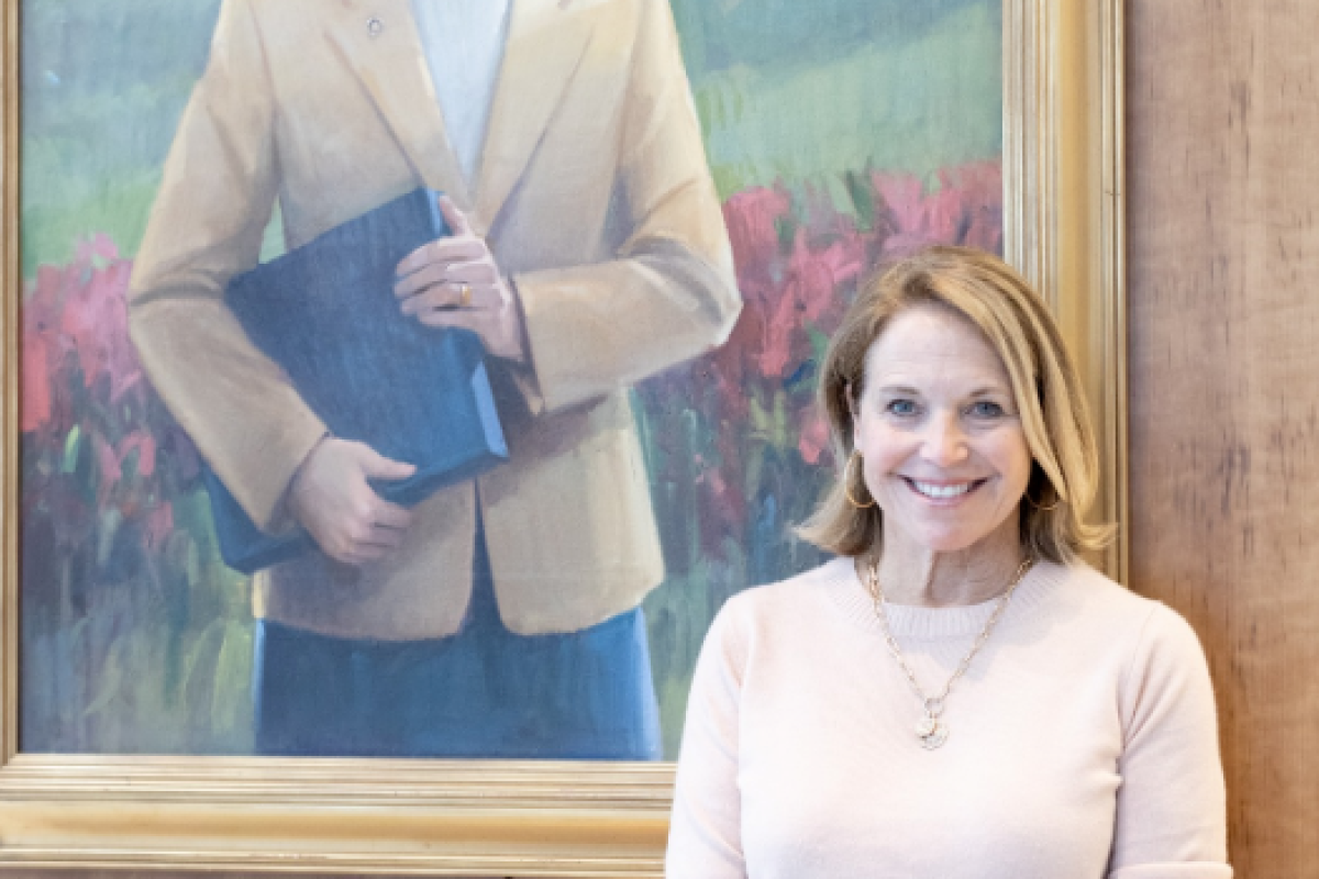 Couric stands in front of a portrait of her late sister