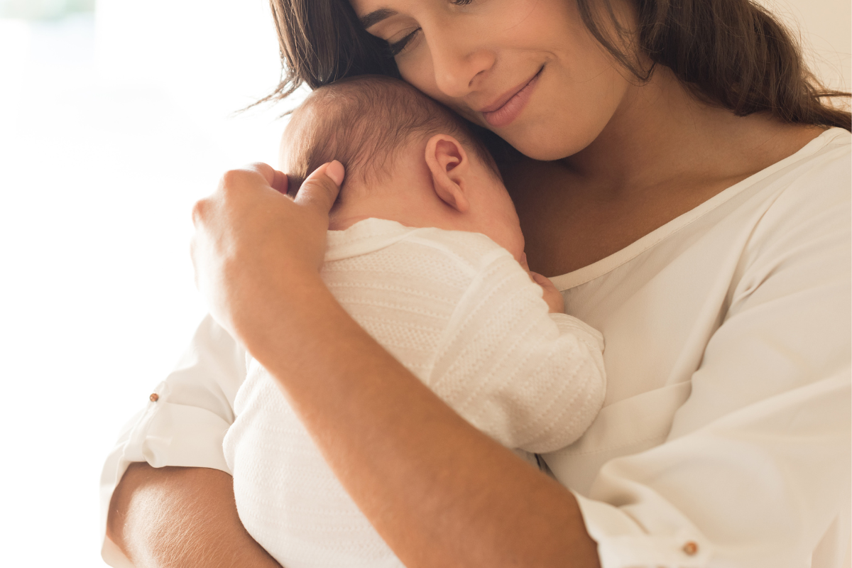 mother holds baby