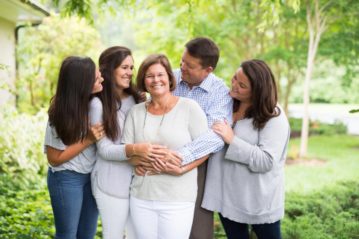 Tana Taylor surrounded by daughters and husband Gary