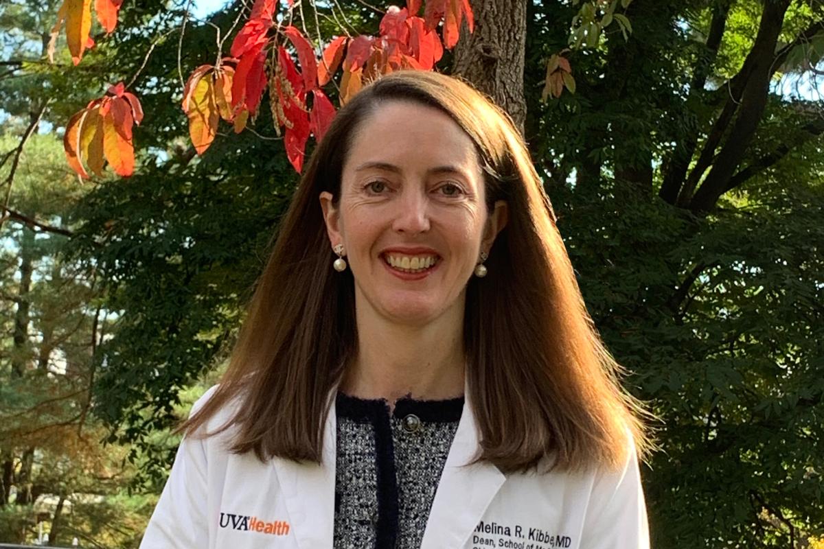 Headshot, Dean Kibbe standing outside smiling