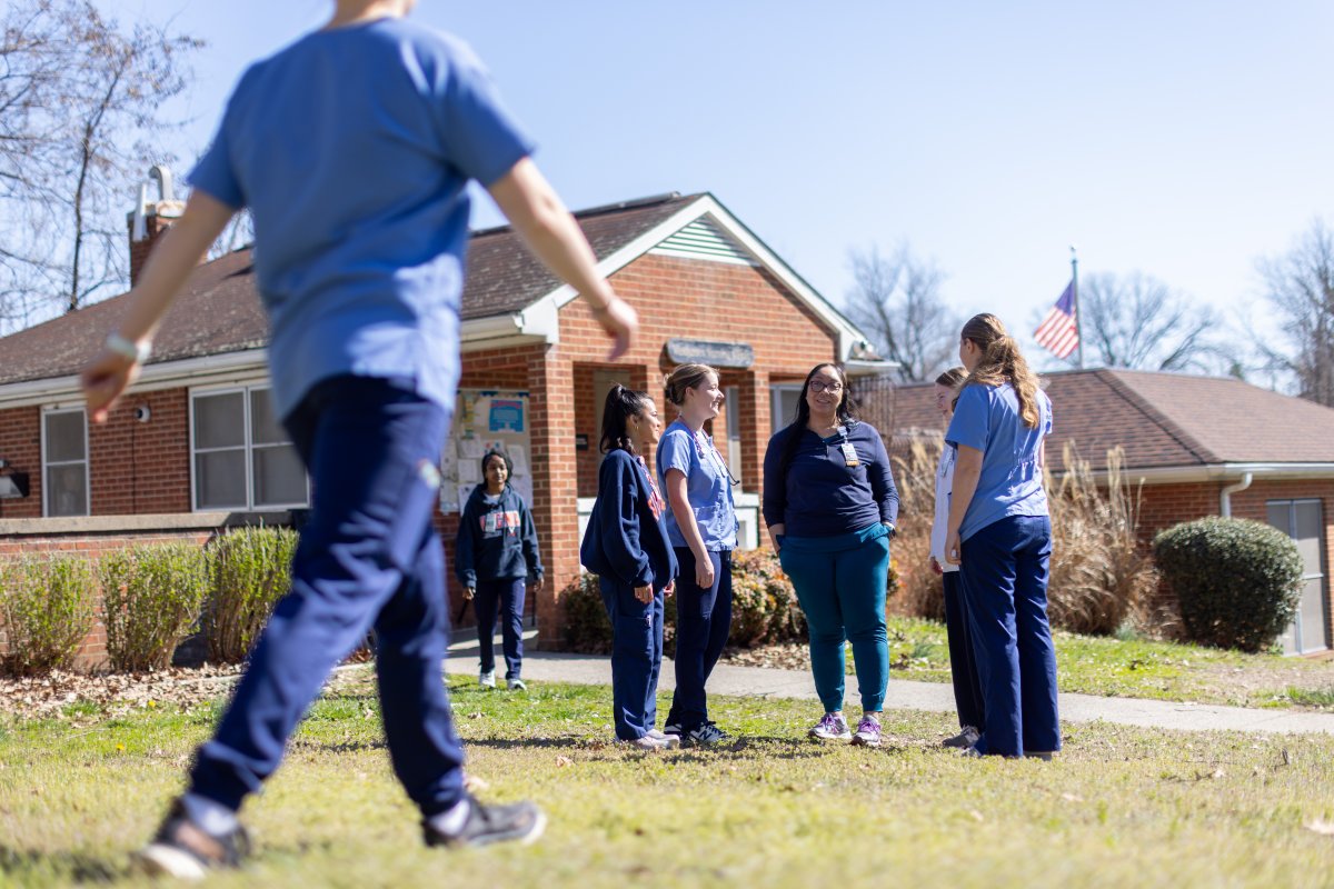nursing students stand outside the westhaven clinic talking