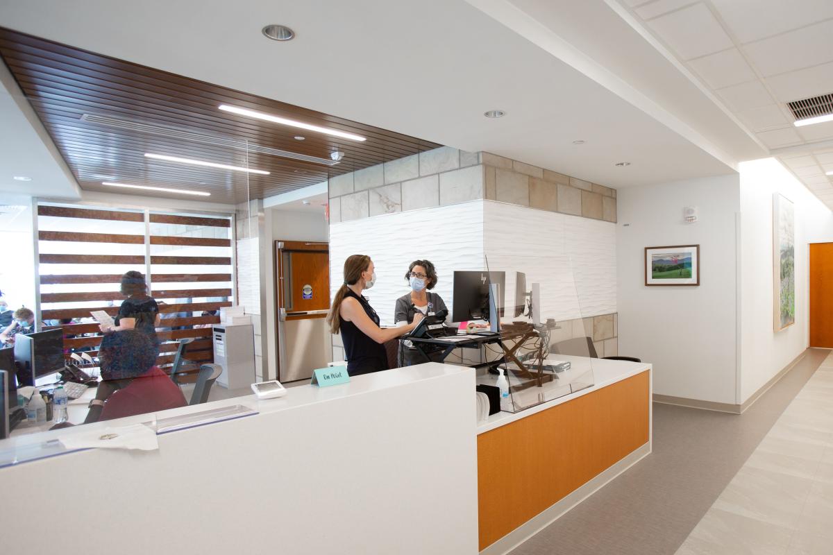 UVA Health staff stand in the lobby of the infusion center. 