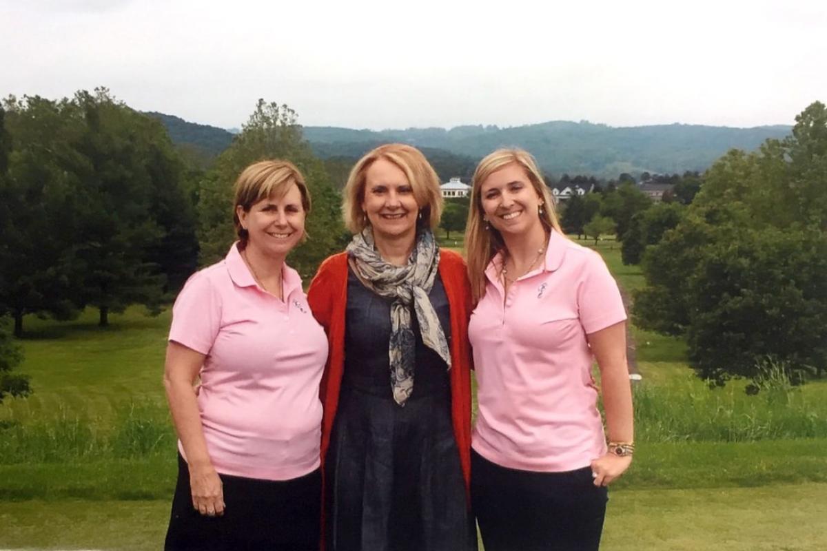 Ginny and Jennifer Marshall (left and right) share a moment with their favorite doctor, Kim Dunsmore, at a Jennifer Fund Golf tournament to support pediatric cancer research.