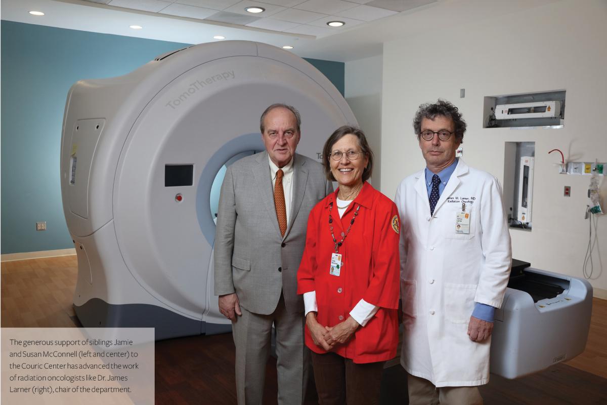 Siblings Jamie and Susan McConnell stand with Dr. James Larner in the McConnell Radiation Suite