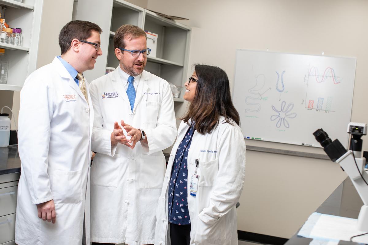 Dr. Sean Moore with his junior faculty mentees, Drs. Daniel Levin (left) and Sana Syed.