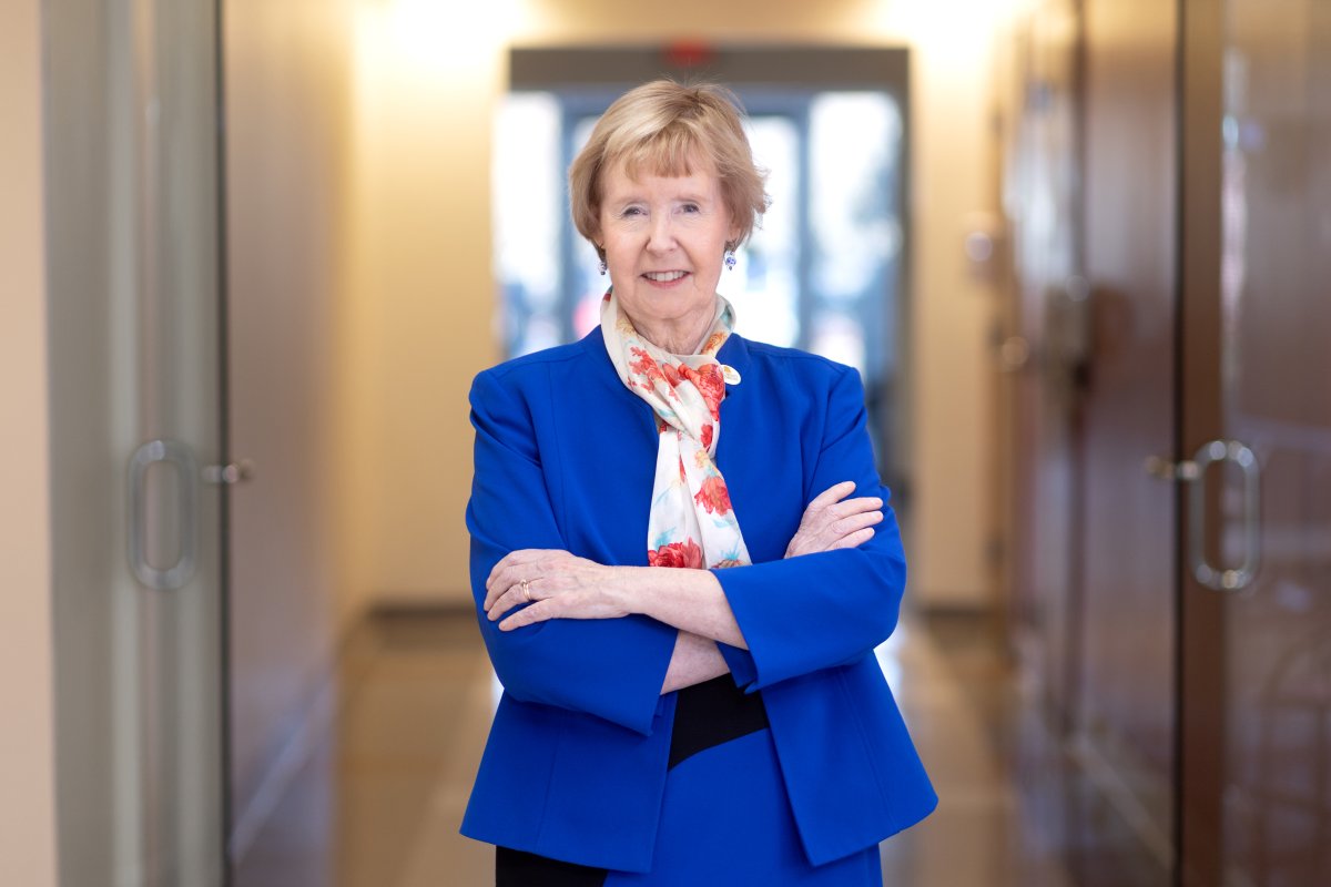 Dr. Pinkerton stands in the hallway