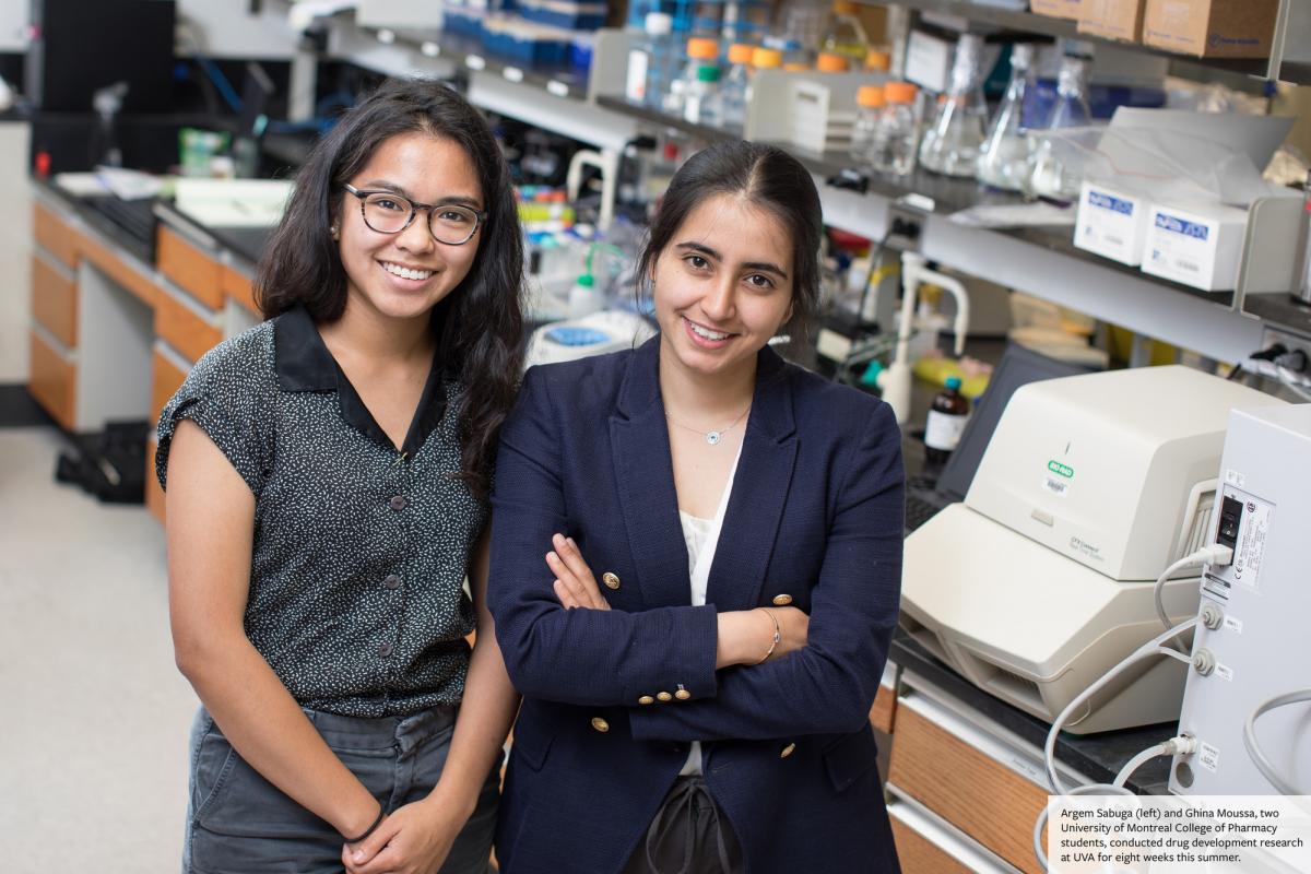 Argem Sabuga (left) and Ghina Moussa stand in the UVA lab where they conducted drug development research for 8 weeks over the summer. 