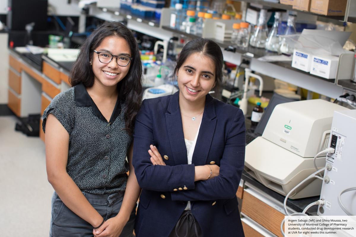 Argem Sabuga (left) and Ghina Moussa stand in the UVA lab where they conducted drug development research for 8 weeks over the summer.