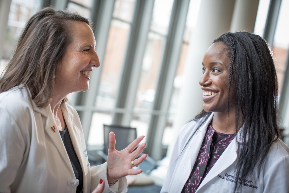 Meg Keeley, MD, (left) and Brittany Smith engage in dialogue 