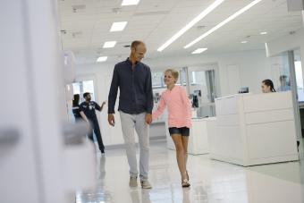 A dad and daughter wlak through the UVA emergency department.