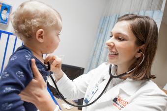 UVA School of Nursing student with a young patient.
